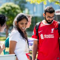 Students looking at materials and talking